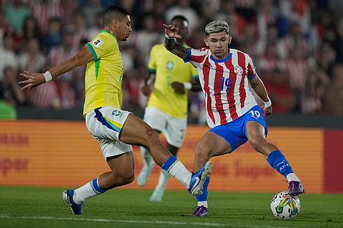 2026 FIFA World Cup Qualifying, Brazil vs Paraguay: Paraguay's Julio Enciso, right, and Brazil's Andre battle for the ball